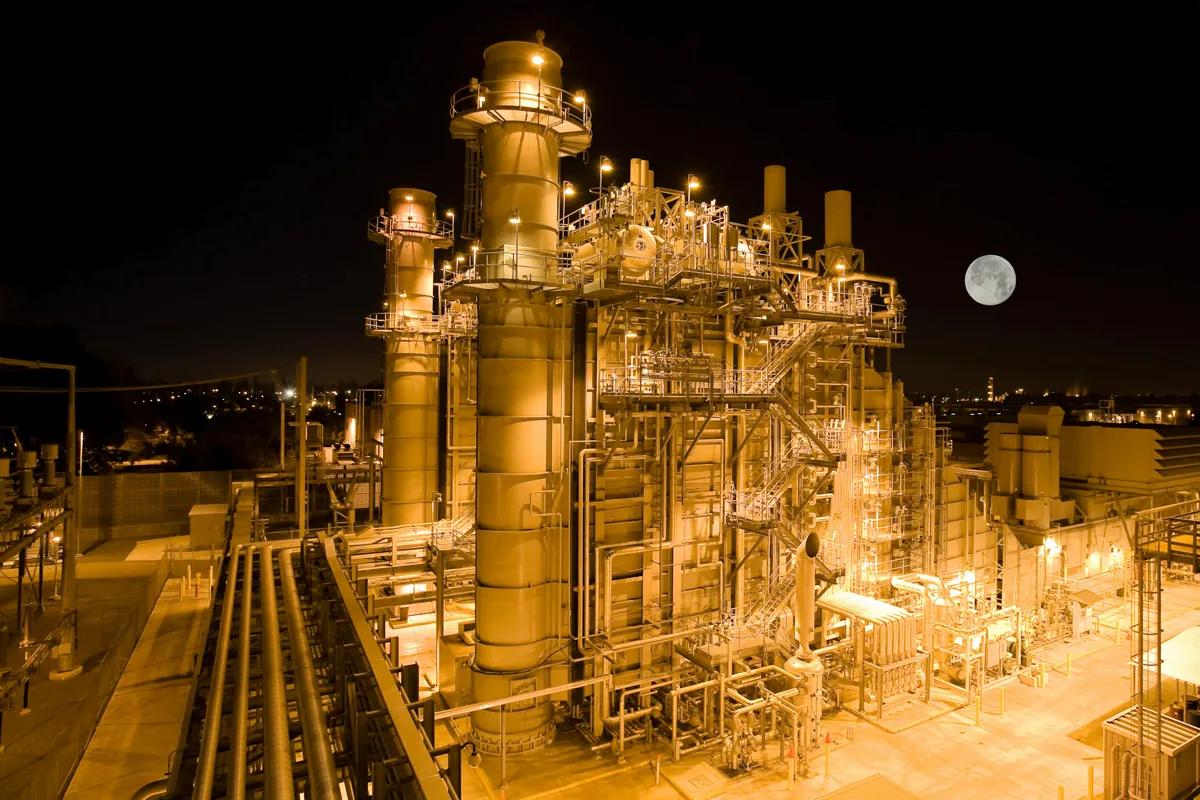 A gas processing plant lit at night